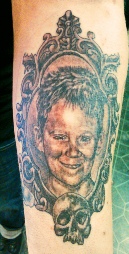  black and grey portrait tattoo of son